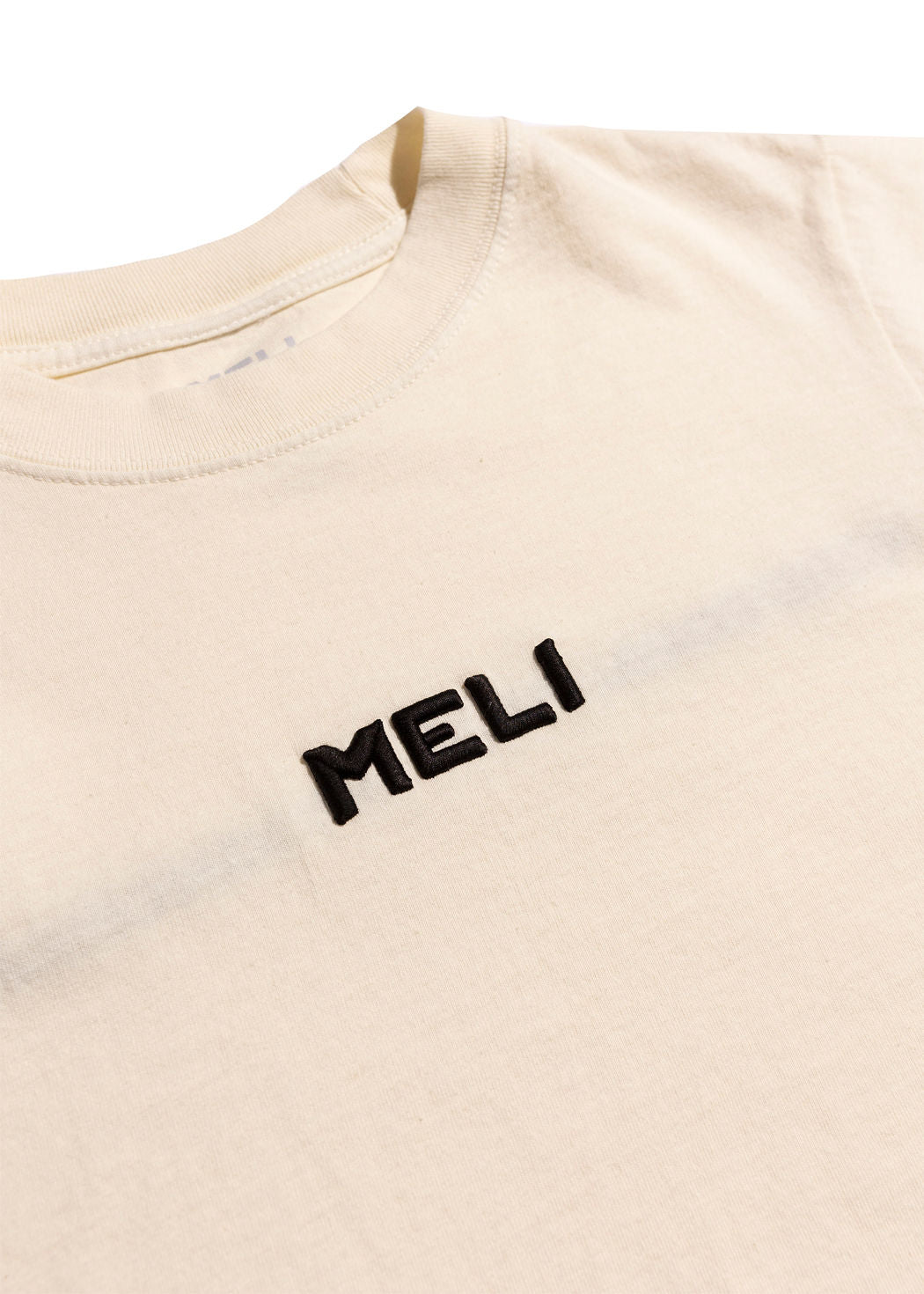 MELI WOMEN'S CROPPED STATEMENT TEE