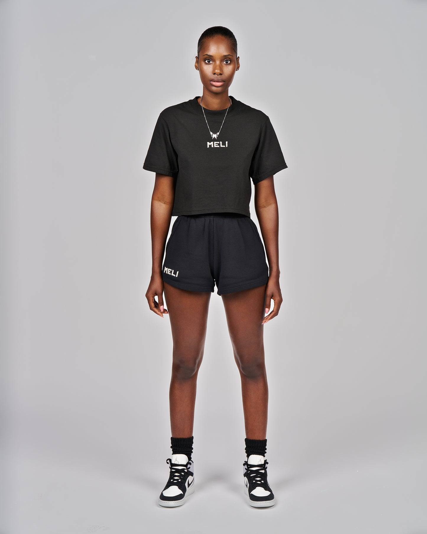 MELI WOMEN'S CROPPED STATEMENT TEE