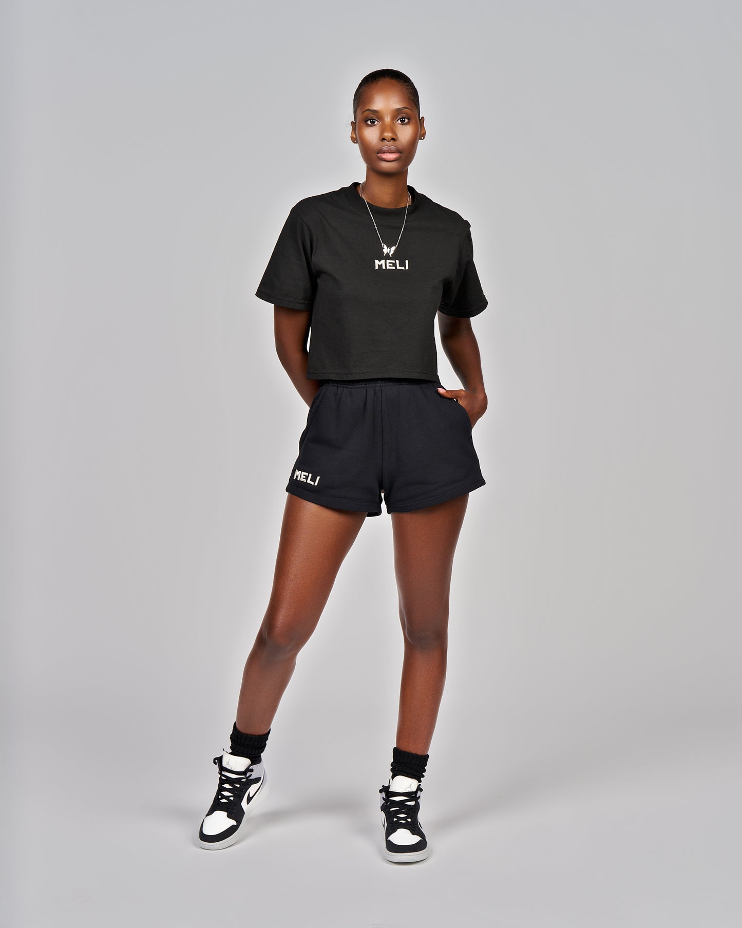 MELI WOMEN'S CROPPED STATEMENT TEE
