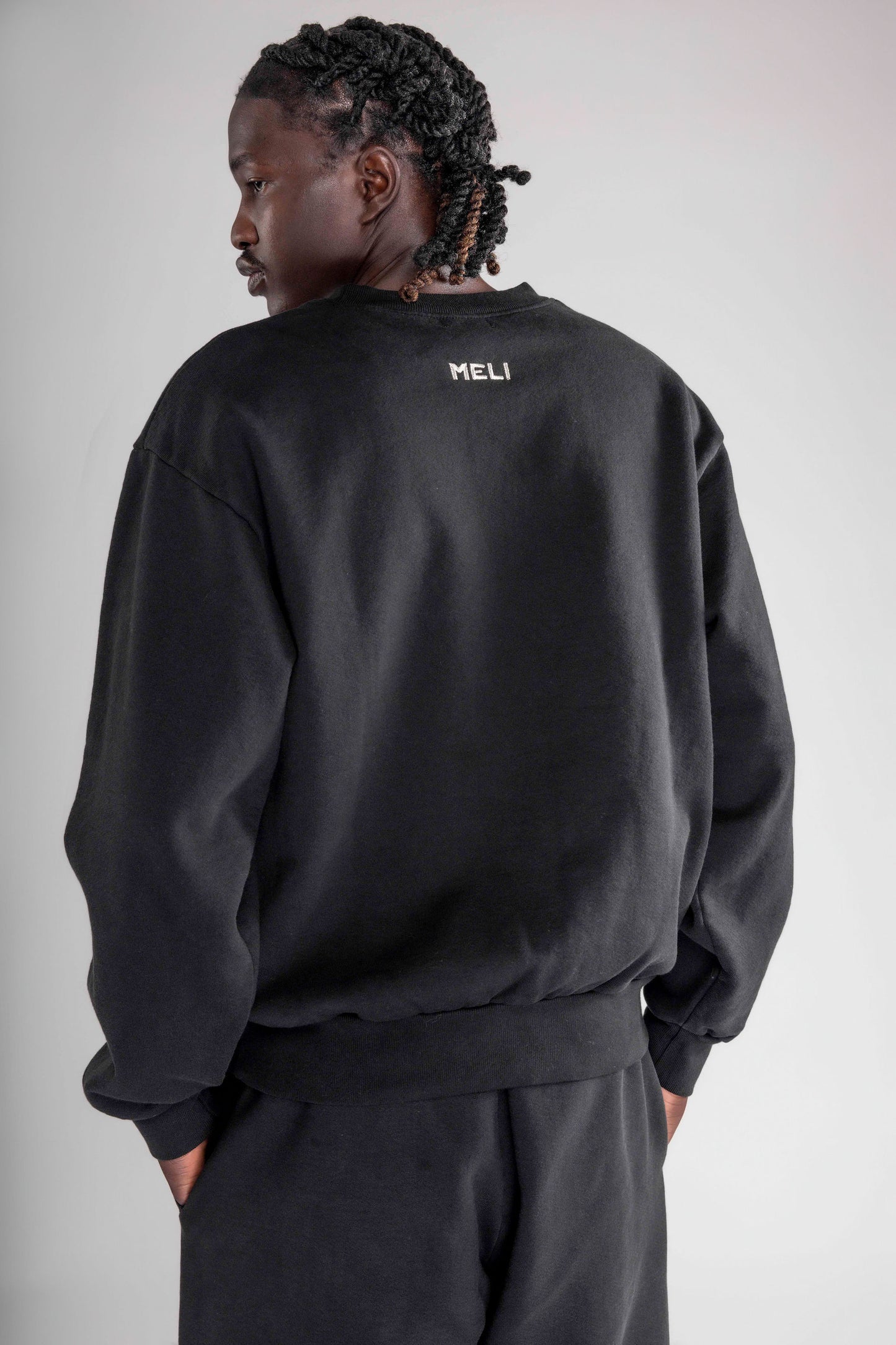 MELI TAGLINE CREWNECK