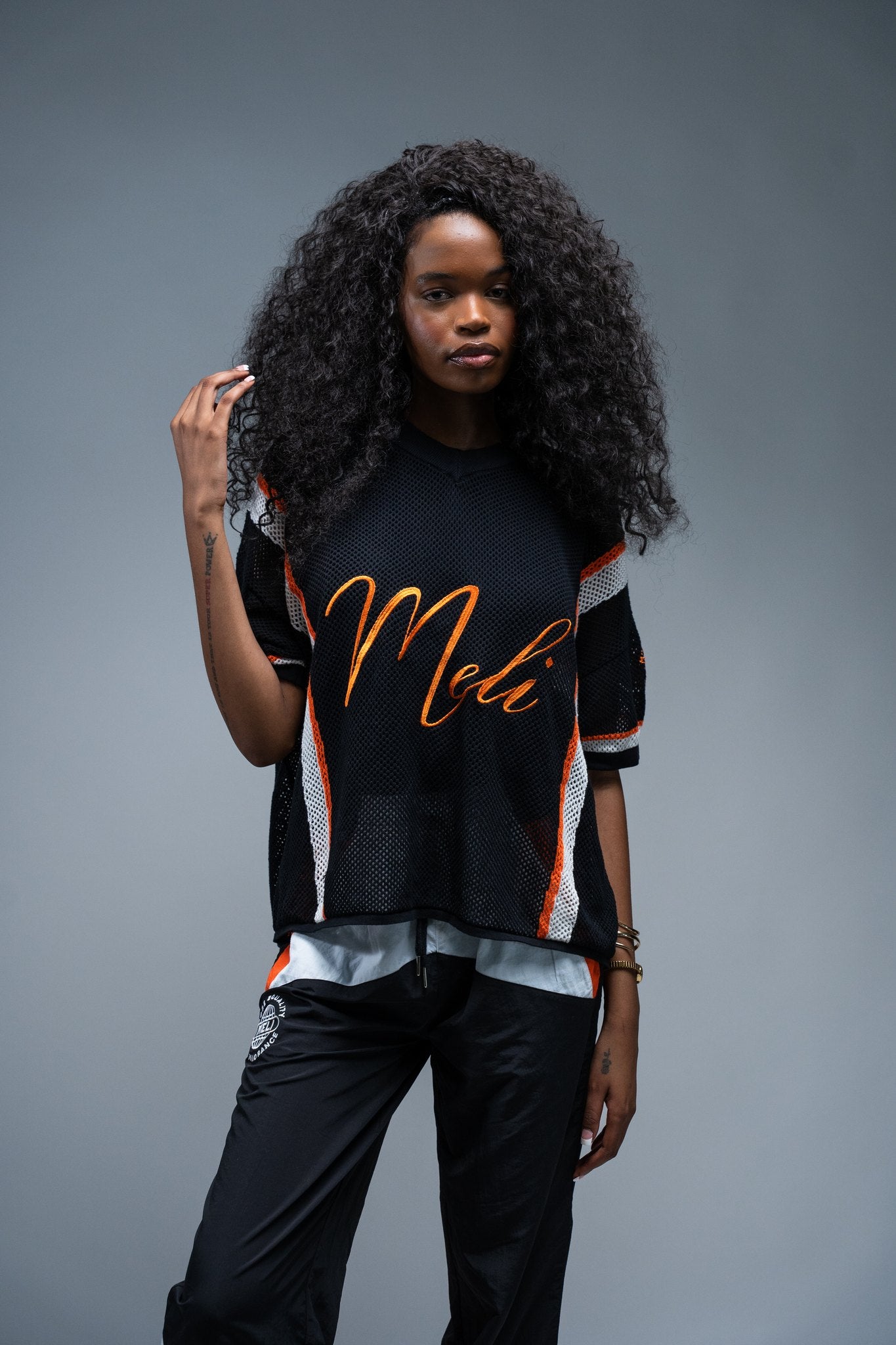 MELI MESH JERSEY — BLACK — Female model