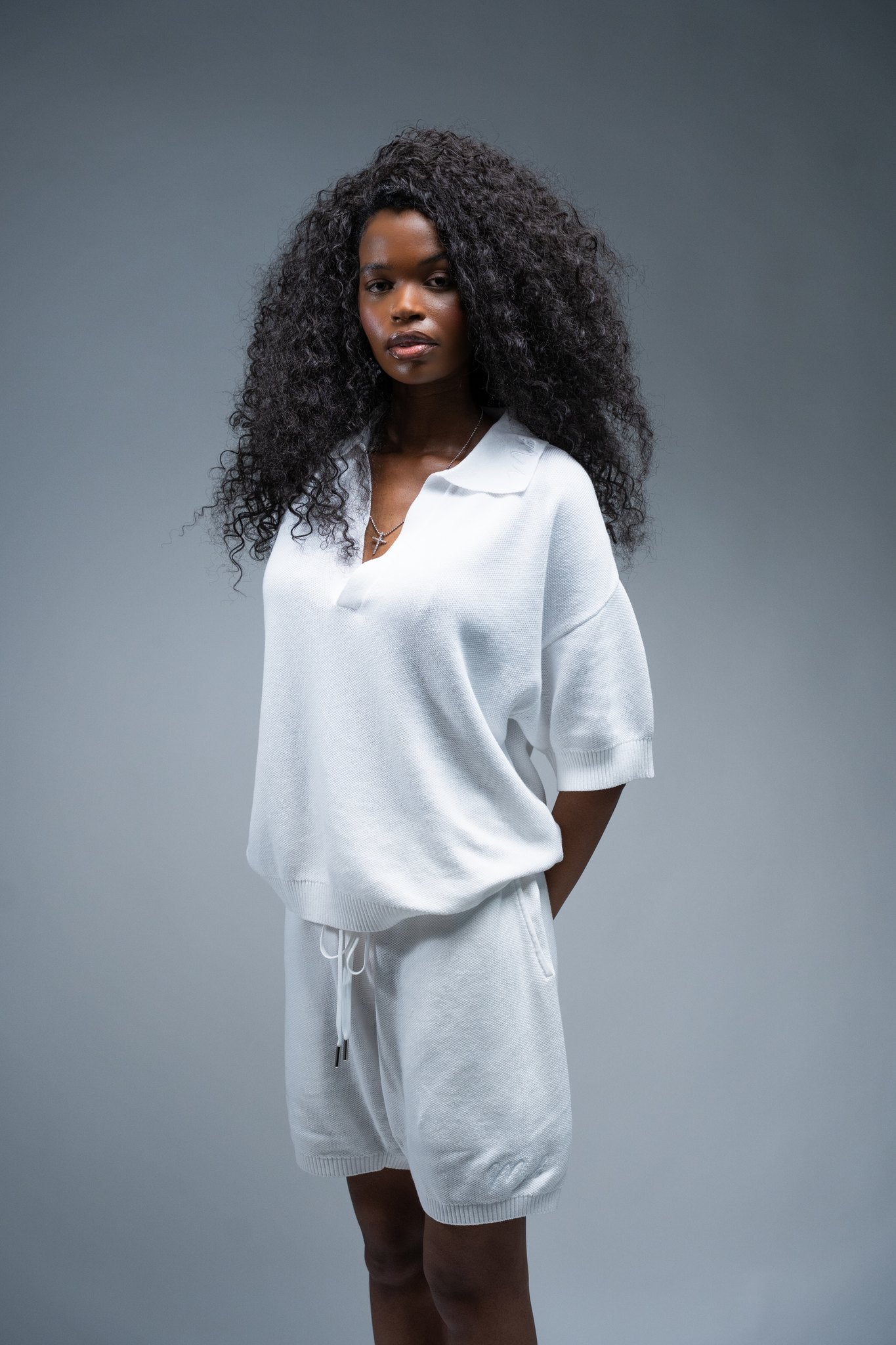 MELI V-NECK KNIT POLO — WHITE — Female model