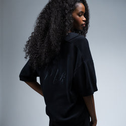 MELI V-NECK KNIT POLO — BLACK — Female model