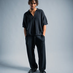 MELI V-NECK KNIT POLO — BLACK — Male model