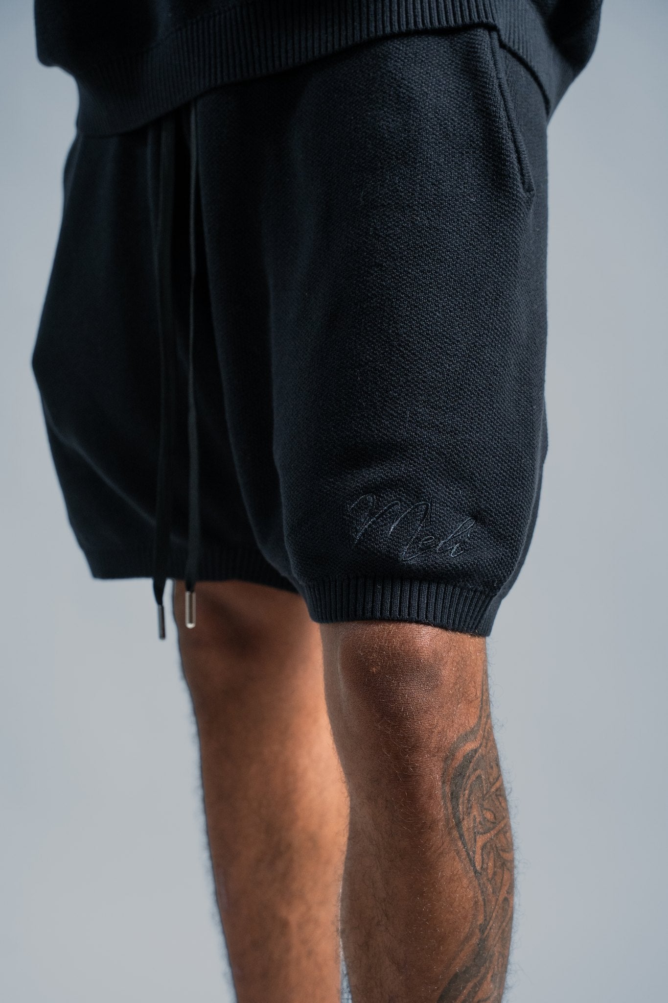 MELI KNIT SHORT — BLACK — Male model
