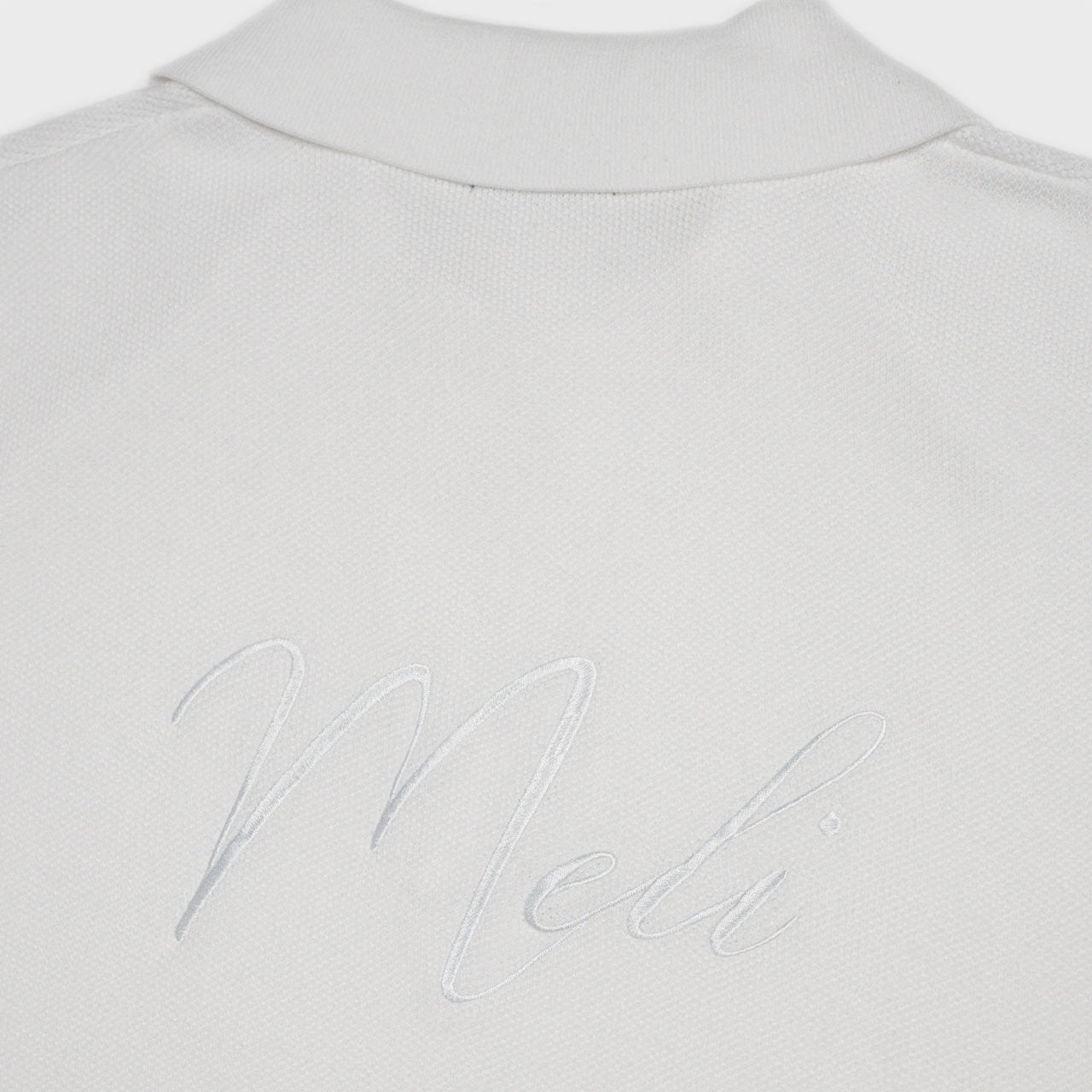 MELI V-NECK KNIT POLO — WHITE