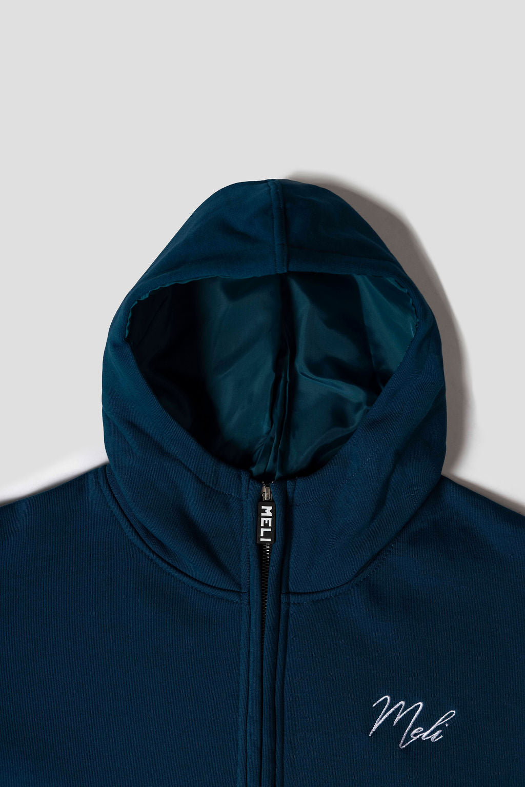 MELI Global Sweatsuit 3.0 in Atlantic, structured satin lined hood