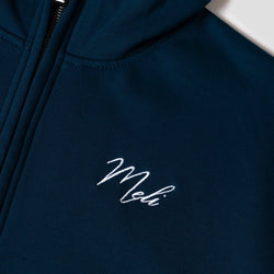 MELI Global Sweatsuit 3.0 in Atlantic, hidden half zip and embroidered MELI script at the chest