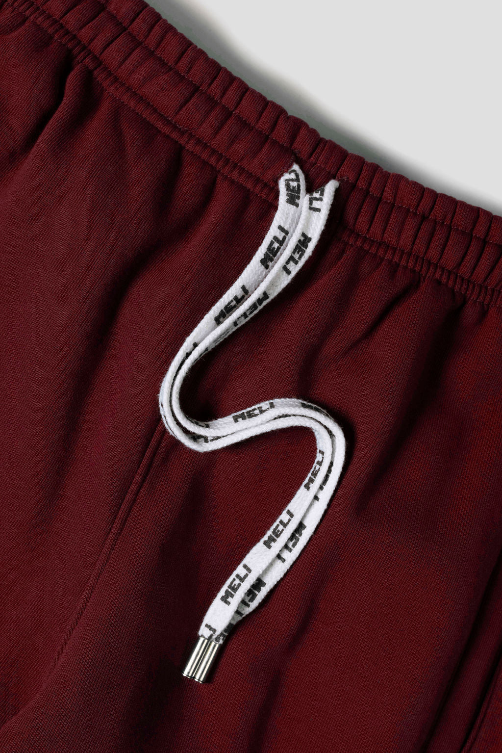 MELI Global Sweatsuit 3.0 in Crimson, custom MELI drawstrings