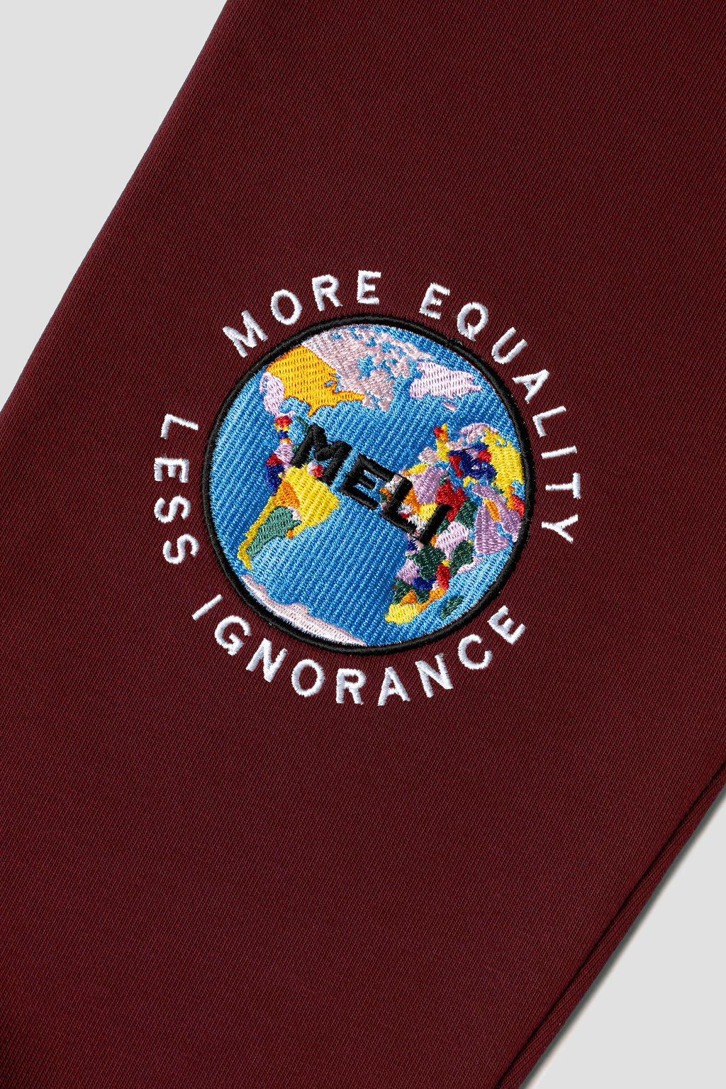 MELI Global Sweatsuit 3.0 in Crimson, embroidered MELI Global map logo at the rear leg