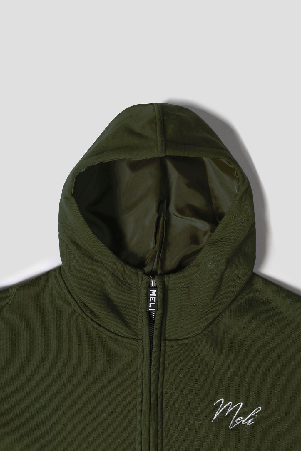 MELI Global Sweatsuit 3.0 in Olive, structured satin lined hood