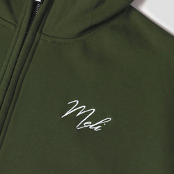 MELI Global Sweatsuit 3.0 in Olive, hidden half zip and embroidered MELI script at the chest