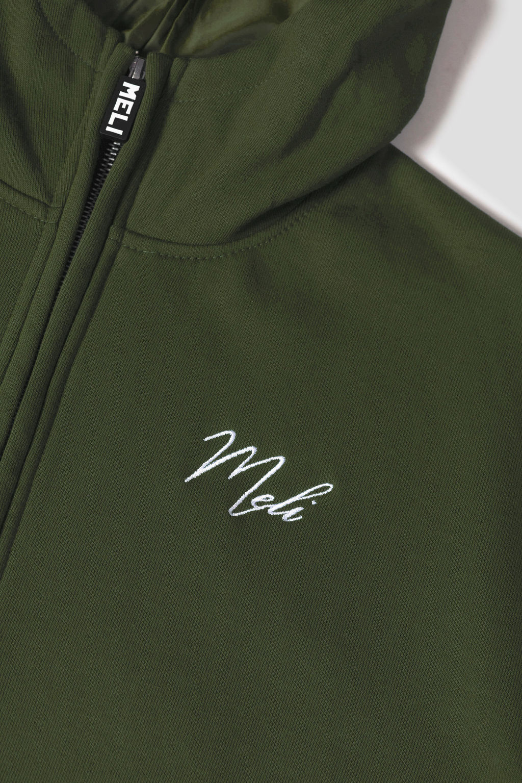 MELI Global Sweatsuit 3.0 in Olive, hidden half zip and embroidered MELI script at the chest