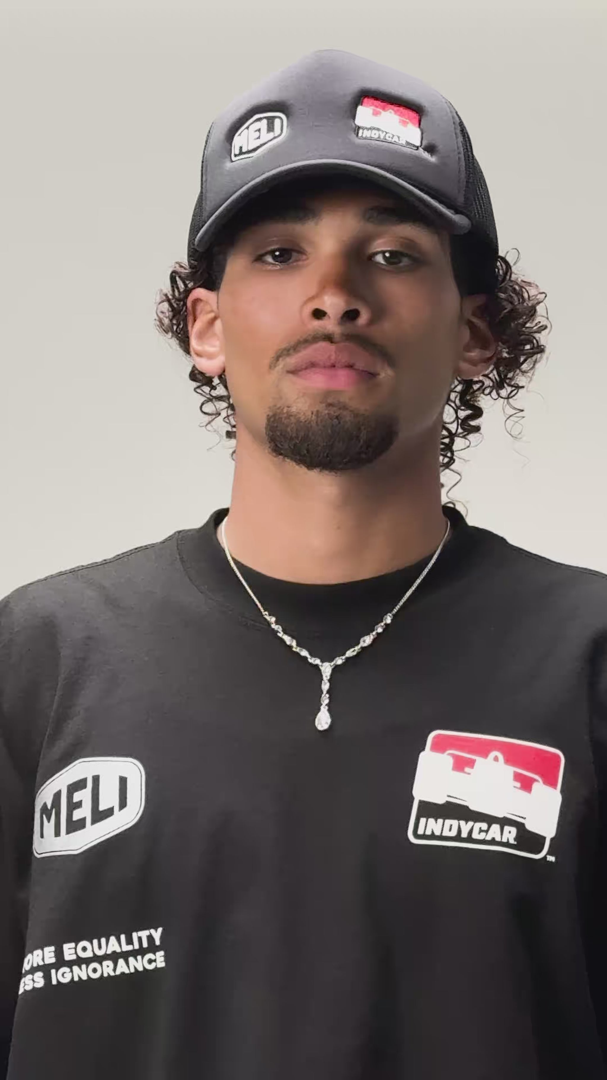 The MELI x INDYCAR trucker hat, worn