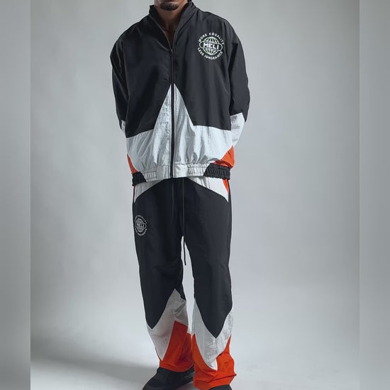 The MELI Starbreaker pant worn with the matching jacket, moving