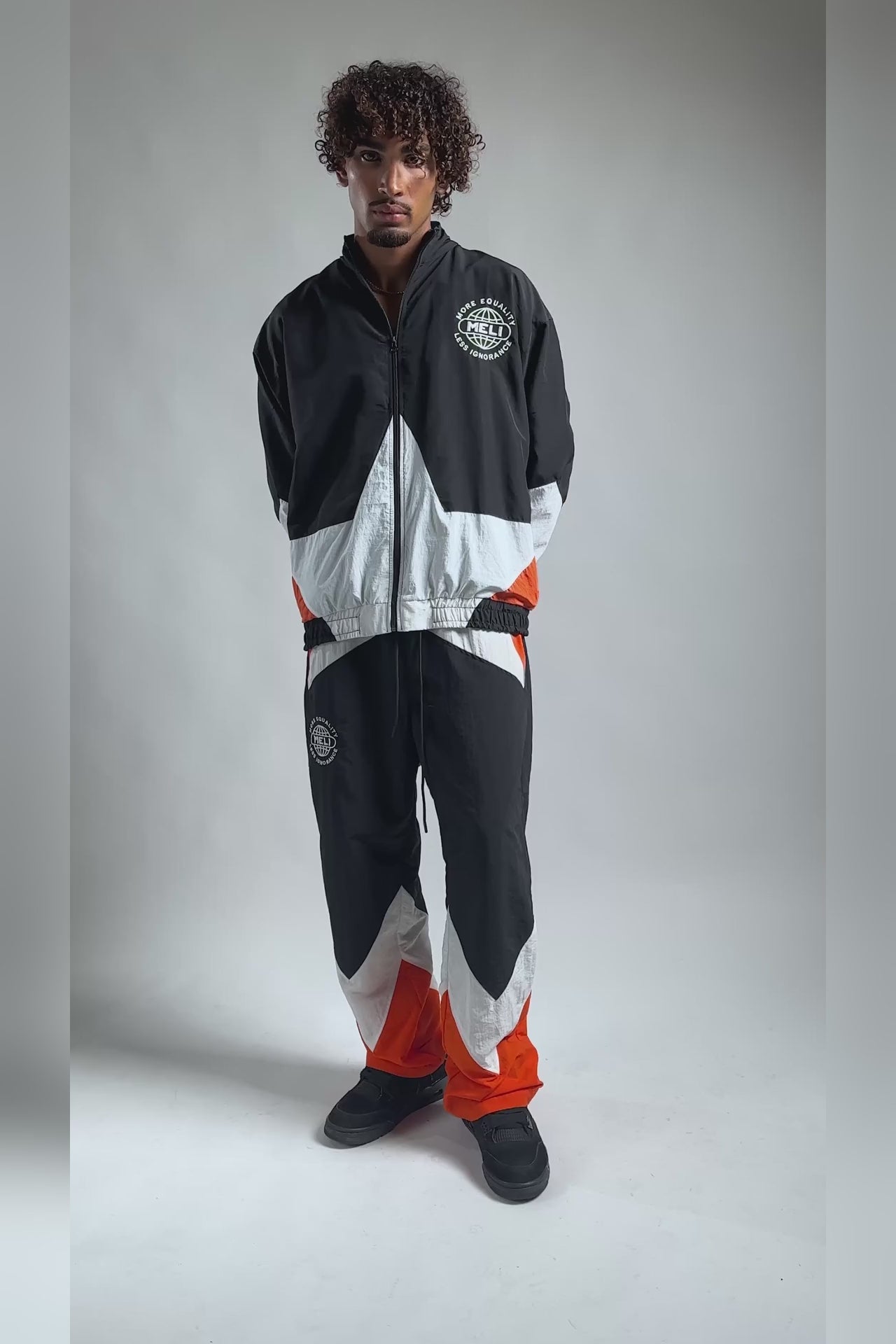 The MELI Starbreaker pant worn with the matching jacket, moving