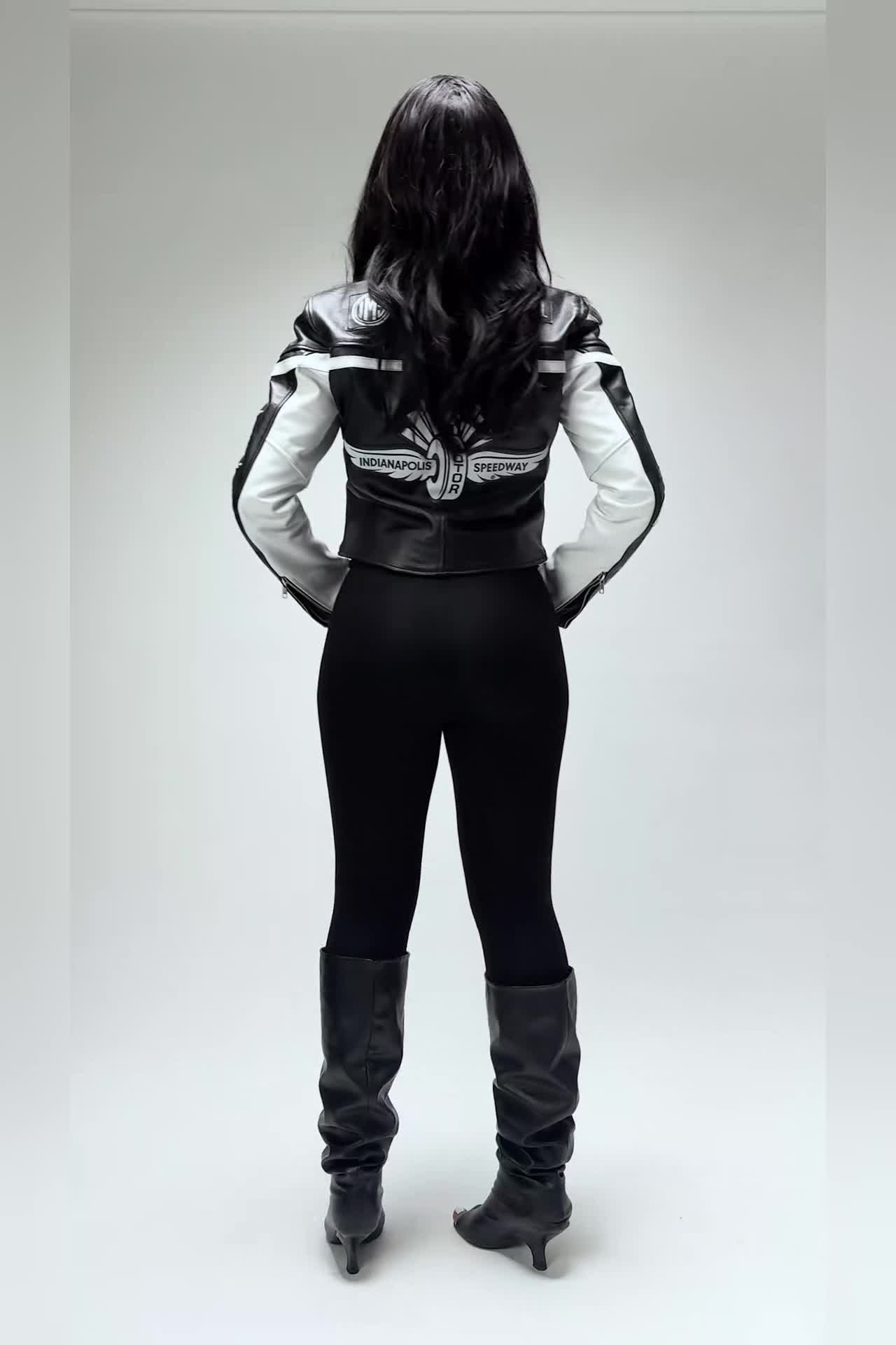 The MELI cropped moto leather jacket, worn and moving